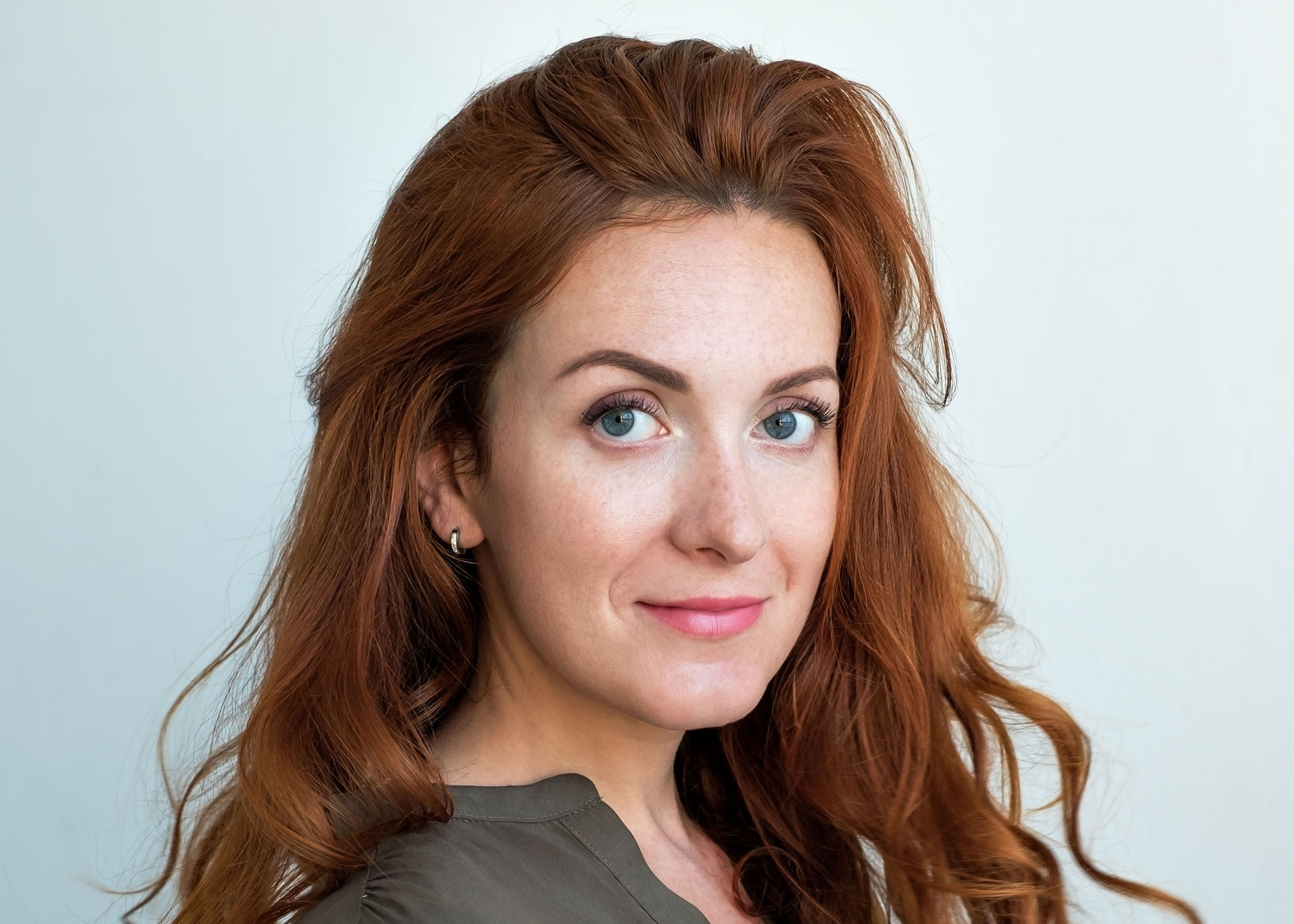 Woman with radiant, healthy-looking skin smiling confidently, showcasing the glowing results of a HydraFacial treatment at Pure 111 Medical Aesthetics.